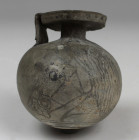 Greek aryballos depicting a horse head