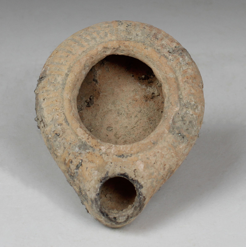 ITEM: Oil lamp
MATERIAL: Pottery
CULTURE: Roman, Holy Land
PERIOD: 3rd Centur...