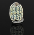 Egyptian scarab with pseudo-hieroglyphic, Su-plants and ankh-signs flanking Wadj and Nefer-signs (luck)