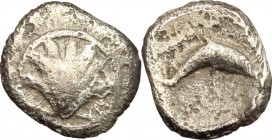Greek Italy. Southern Apulia, Tarentum. AR Hemilitron, 325-280 BC. D/ Shell. R/ Dolphin right. HN Italy 980. AR. g. 0.33 mm. 8.00 Toned. VF/About VF.