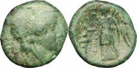 Greek Italy. Bruttium, Hipponium. AE, c. 296 BC. D/ Head of Athena right, helmeted. R/ Nike standing left; holding wreath and scepter; to right, troph...