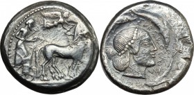 Sicily. Syracuse. AR Tetradrachm, 485-465 BC. D/ Quadriga right; above, flying Nike crowning the horses. R/ Head of Arethusa right, surrounded by four...