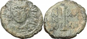 Justinian I (527-565). AE Decanummium, Theupolis (Antioch) mint, 560-561. D/ Bust of Justinian facing, helmeted. R/ Mark of value (I). MIB 159. DOC 26...