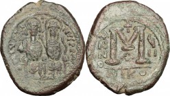 Justin II (565-578). AE Follis, Nicomedia mint, 571-572. D/ Justin and his wife enthroned frontal. R/ Mark of value (M). MIB 46b. DOC 92-103. Sear 369...
