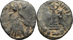 Islamic pre-reform coinage. Abd al-Malik (685-705). AE, Hims mint, 685-705. D/ Caliph standing facing; placing his right hand on sword. R/ Transformed...