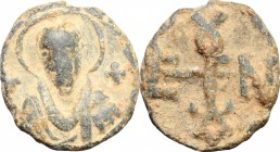 PB Bulla, 6th-7th century. D/ Bust of a saint facing, nimbate. R/ Monogram. PB. g. 6.52 mm. 18.00 VF.