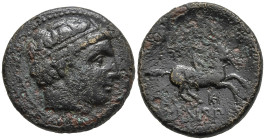 KINGS OF MACEDON. Philip II (359-336 BC). Uncertain mint in Macedonia.
AE Bronze (19.7mm 5.45g)
Obv: Diademed head of Apollo toright
Rev: Youth on ...