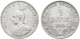 DEUTSCHE KOLONIEN. DEUTSCH OSTAFRIKA 1/2 Rupie (5.76g). 1912 J, Hamburg. Behelmtes Brustbild von Kaiser Wilhelm II. in Uniform des Garde du Corps nach...