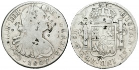 Carlos IV (1788-1808). 8 reales. 1807. México. TH. (Cal-707). Ag. 26,65 g. Resellos orientales. BC+/MBC-. Est...60,00.