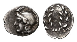 Aeolis, Elaia. AR Tetartemorion, 0.24 g. - 6.97 mm. Circa 450-440 BC.
Obv.: Helmeted head of Athena left.
Rev.: [E] - Λ - [A] - [I]. Wreath within inc...