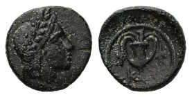 Bithynia, Kios. AE, 1.06 g. - 11.79 mm. ca.3rd century BC.
Obv.: Head of Mithras right, wearing a laureate tiara.
Rev.: K-I. Kantharos with two grape ...
