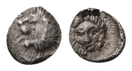 Caria, Hekatomnos (Satrap of Caria). Circa 392/1-377/6 BC. AR Tetartemorion, 0.23 g. - 7.01 mm. 
Obv.: Head of roaring lion left.
Rev.: Laureate head ...