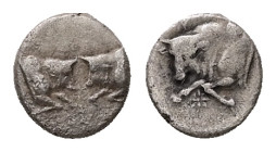 Caria, Uncertain. AR Hemiobol, 0.36 g. - 6.67 mm. 5th century BC.
Obv.: Confronted foreparts of two bulls.
Rev.: Forepart of a bull to left; between h...