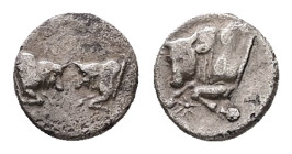 Caria, Uncertain. AR Hemiobol, 0.38 g. - 7.12 mm. 5th century BC.
Obv.: Confronted foreparts of two bulls.
Rev.: Forepart of a bull to left; between h...