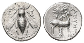 Ionia, Ephesos. AR Drachm, 4.15 g. - 17.94 mm. Circa 387-295 BC. Amyntes, magistrate.
Obv.: Ε - Φ. Bee.
Rev.: AMYNTHΣ, Stag standing right; palm tree ...