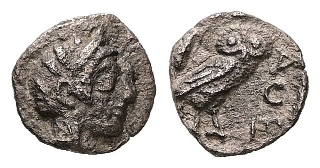 Attica, Athens. AR Obol, 0.55 g. - 9.28 mm. Circa 454-404 BC.
Obv.: Helmeted hea...