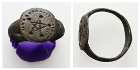 AE Late Roman finger-ring (AD 4th-6th centuries)
Bronze finger-ring; hoop expanding to flat angular shoulders each decorated with star. Oval bezel wit...