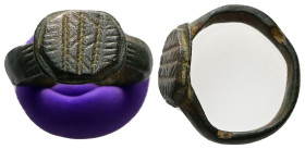 AE Early Byzantine signet-ring (AD 6th-8th centuries)
Bronze signet-ring; raised octagonal bezel engraved with linear design.
Weight: 5.35 g.
Diameter...