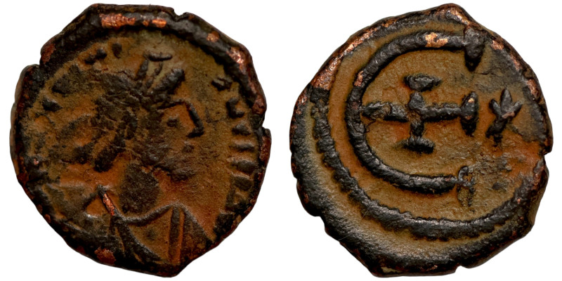 Byzantine bronze coin

15mm 2,19g

 Artifically sand patina