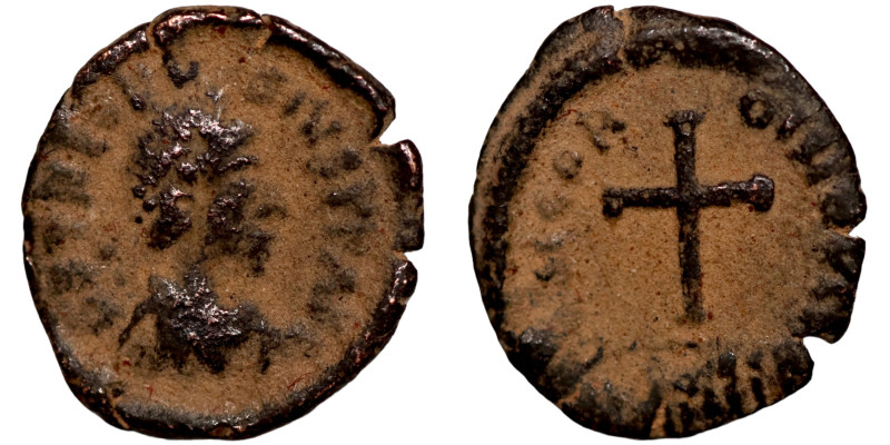 Byzantine bronze coin

12mm 0,60g

 Artifically sand patina