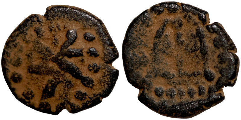 Byzantine bronze coin

11mm 1,46g

 Artifically sand patina