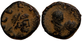 Byzantine bronze coin

9mm 1,42g

 Artifically sand patina