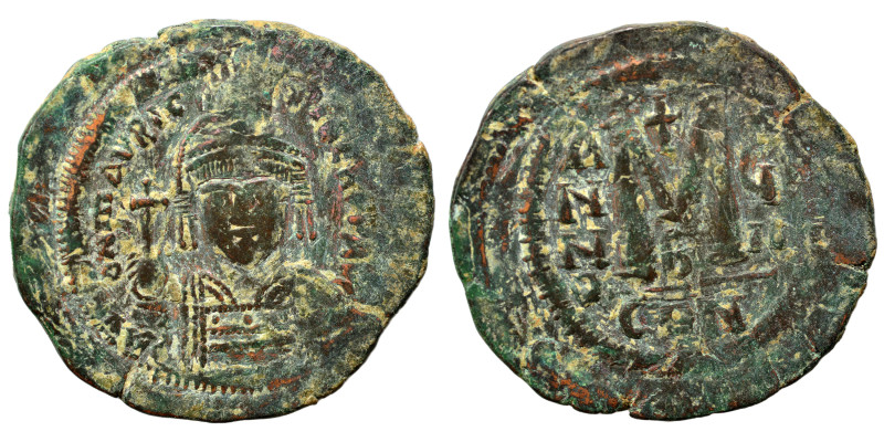 Justinian I, 527-565. Follis (bronze, 10.64 g, 33 mm), Constantinople. Helmeted,...