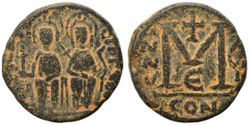 Justin II, with Sophia, 565-578. Follis (bronze, 11.32 g, 25 mm), Constantinople. Nimbate figures of Justin and Sophia seated facing on double throne,...