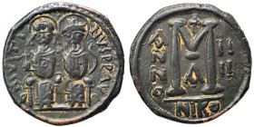 Justin II, with Sophia, 565-578. Follis (bronze, 12.37 g, 31 mm), Nicomedia. Justin, holding globus cruciger, and Sophia, holding cruciform scepter, s...