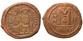 Justin II, with Sophia, 565-578. Follis (bronze, 15.27 g, 31 mm), Nicomedia. Justin, holding globus cruciger, and Sophia, holding cruciform scepter, s...
