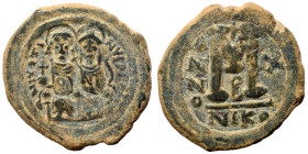 Justin II, with Sophia, 565-578. Follis (bronze, 13.65 g, 30 mm), Nicomedia. Justin, holding globus cruciger, and Sophia, holding cruciform scepter, s...
