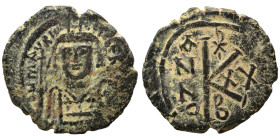 Maurice Tiberius, 582-602. Half follis (bronze, 6.73 g, 25 mm), Constantinople. Crowned and cuirassed bust facing, holding globus cruciger and shield ...