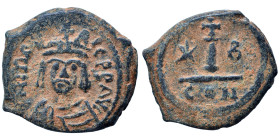 Maurice Tiberius, 582-602. Dekanummium (bronze, 3.35 g, 18 mm), Constantinople. D N mAVRICI PP AVG Helmeted, draped, and cuirassed bust facing. Rev. L...