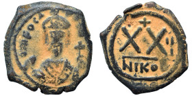 Phocas, 602-610. Half follis (bronze, 5.14 g, 23 mm), Nicomedia. Crowned and cuirassed facing bust, holding mappa and cross Rev. Large XX; cross above...