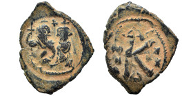 Heraclius, with Heraclius Constantine, 610-641. Half Follis (bronze, 3.12 g, 23 mm), Constantinople. Heraclius, wearing military attire and holding lo...