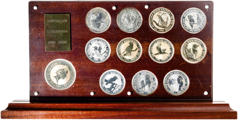 Australia. 1990 a 2000. 1 (once) y 2 dólares. Expositor con 12 monedas Kookaburr...