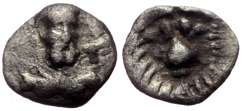 Cilicia, Uncertain AR Tetartemorion (Silver, 0.23g, 7mm) 
Obv: Laureate and bear...