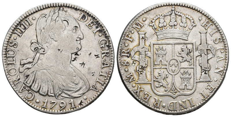 CARLOS IV. 8 reales. México 1791. FM. AR 26,78 g. 38,3 mm. VI-787. Resellos orie...