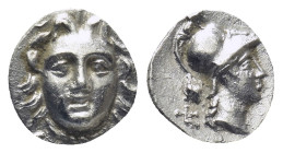 Pisidia. Selge circa 350-300 BC. Obol AR (0.64 Gr. 9mm.) 
Gorgoneion. 
Rev. Head of Athena to right, wearing crested Attic helmet; behind, astragalos.