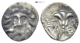 CARIA, Mylasa. Early-mid 2nd century BC. AR Drachm (16mm, 2.0 g). Pseudo-Rhodian type. Are–, magistrate. Head of Helios facing; bird at cheek to left ...