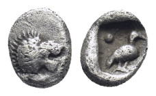 CARIA. Mylasa. Tetartemorion (Circa 420-390 BC). (0.31 Gr. 6mm.)
Head of roaring lion right.
 Rev: Bird standing right; pellet to upper left and lower...