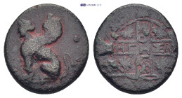 Ionia, Chios 4th Century BC. AE (14mm, 2.9 g). Sphinx standing left  at obverse. Vine-wreaths encircling two bands placed crosswise on reverse. ΕΓΕΣ l...