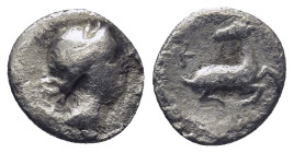 Ionia, Ephesos (?) AR Trihemiobol. Circa 340-325 BC. (0.75 Gr. 10mm.)
 Draped bust of Artemis right, quiver at shoulder 
Rev. Stag kneeling right, hea...