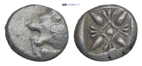 Ionia. Miletos circa 525-475 BC. Diobol AR (9 mm, 1,10 g) Forepart of lion to right, his head turned back to left / Star-shaped floral ornament within...