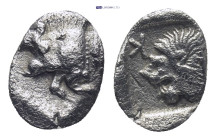 Mysia, Cyzicus, AR Hemiobol, 5th century BC. (0.4 Gr. 9mm.)
Forepart of boar left, tunny upward behind. 
Rev. Head of roaring lion left within square ...