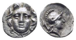 PISIDIA. Selge. Obol (Circa 300-190 BC). (0.77 Gr. 10mm.)
 Gorgoneion.
 Rev. Helmeted head of Athena right, spear head behind.