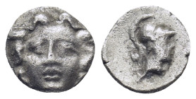 Pisidia. Selge circa 350-300 BC. Obol AR (0.64 Gr. 10mm.) 
Gorgoneion. 
Rev. Head of Athena to right, wearing crested Attic helmet; behind, astragalos...