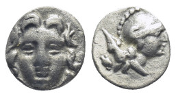 Pisidia. Selge circa 350-300 BC. Obol AR (0.7 Gr. 9mm.) 
Gorgoneion. 
Rev. Head of Athena to right, wearing crested Attic helmet; behind, astragalos.