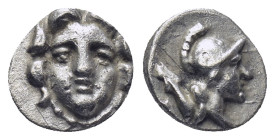 Pisidia. Selge circa 350-300 BC. Obol AR (0.73 Gr. 10mm.) 
Gorgoneion. 
Rev. Head of Athena to right, wearing crested Attic helmet; behind, astragalos...