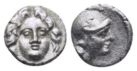 Pisidia. Selge circa 350-300 BC. Obol AR (0.92 Gr. 9mm.) 
Gorgoneion. 
Rev. Head of Athena to right, wearing crested Attic helmet; behind, astragalos.